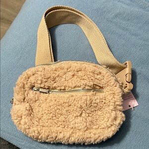 Tan Plush Crossbody Bag with Soft Material and Woven Strap
